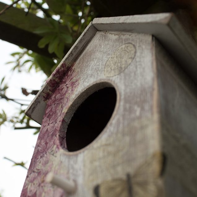 Decorated wooden birdhouse